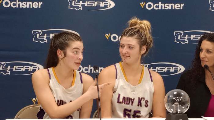 South Beauregard's Kaelyn Gunter (left) talks to head coach Susan Johnson (right) while teammate Emorie Fontenot looks on after the Lady Knights' Division II non-select semifinal victory Feb. 28, 2024.
